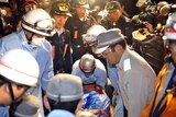 An earthquake victim is carried into an ambulance in Kurihara city, Japan.