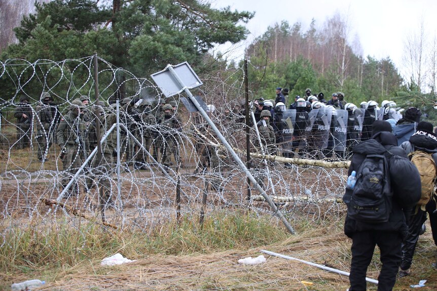 Riot police guard the Poland-Belarus border