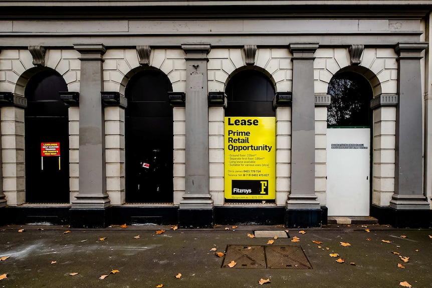 A former restaurant on Lygon st which has now closed, and has a large yellow for lease sign on its window.