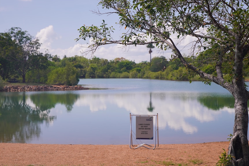 Lake Alexander is seen with a lake closure sign places in front of it.