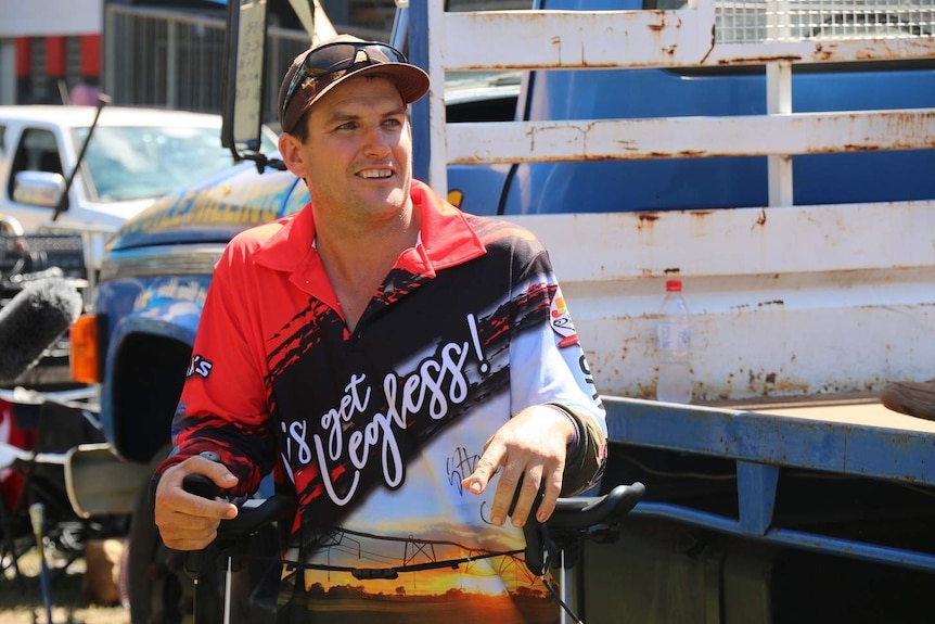 Farmer Gavin Howie next to a ute.