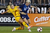 Matildas defender Alanna Kennedy tackles Megan Rapinoe in a match between Australia and USA in East Hartford in July 2018