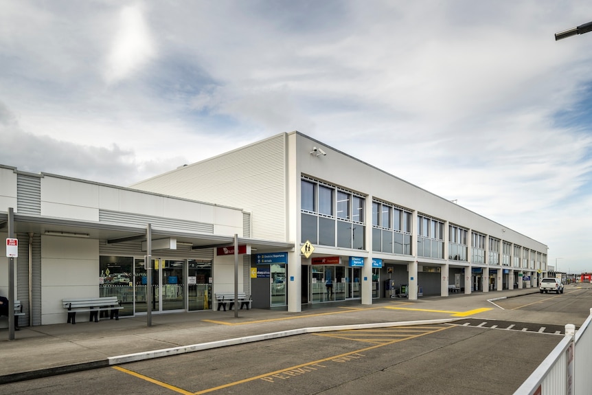 An exterior photograph of the Launceston Airport passenger terminal.