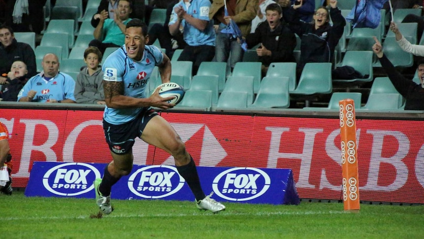 He'll play anywhere ... Israel Folau runs in to score against the Chiefs.