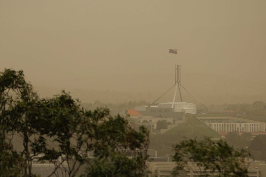 Parliament House through the dust