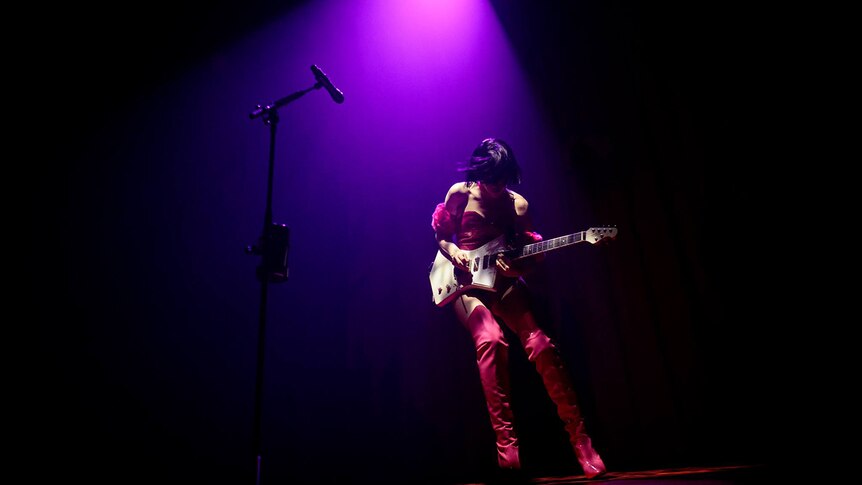 Annie Clark - aka St Vincent - plays guitar on stage at Hobart's Dark Mofo festival