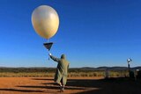 A weather balloon is launched at the Giles Weather Station in Western Australia.