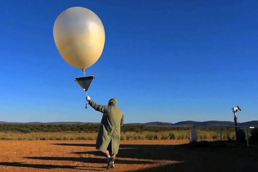 A weather balloon is launched at the Giles Weather Station in Western Australia.