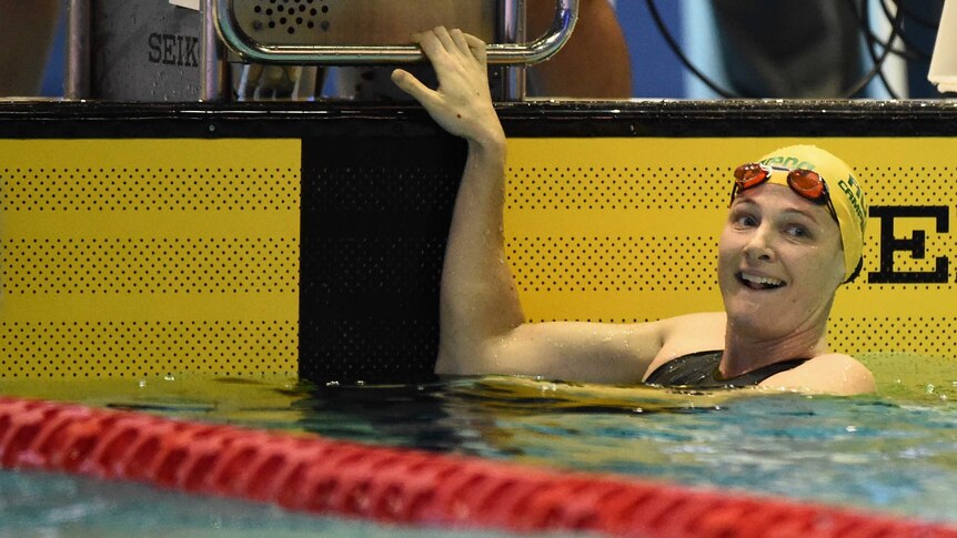 Cate Campbell leans back at the end of the pool after a race.
