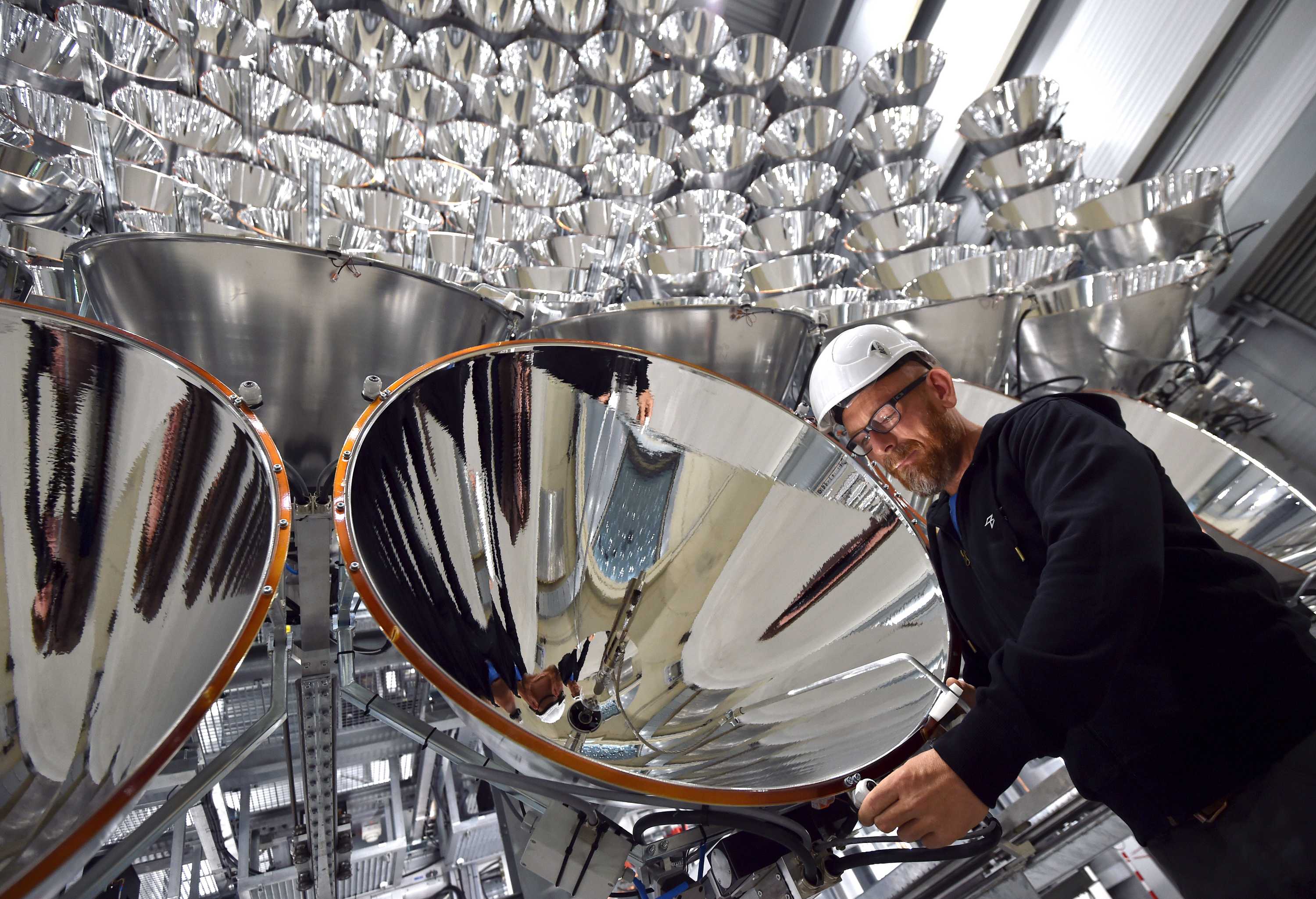 Photo engineer Volkmar Dohmen stands in front of xenon short-arc lamps.