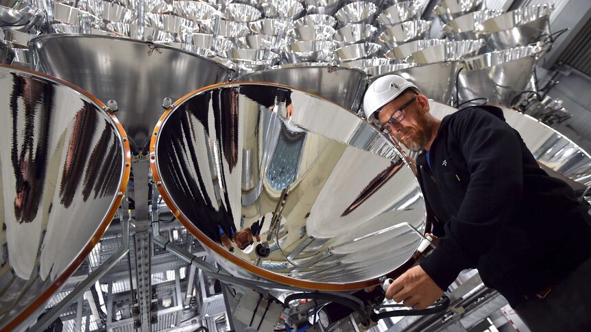 Photo engineer Volkmar Dohmen stands in front of xenon short-arc lamps.