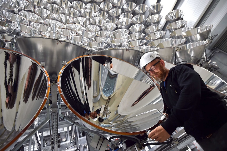 Photo engineer Volkmar Dohmen stands in front of xenon short-arc lamps.