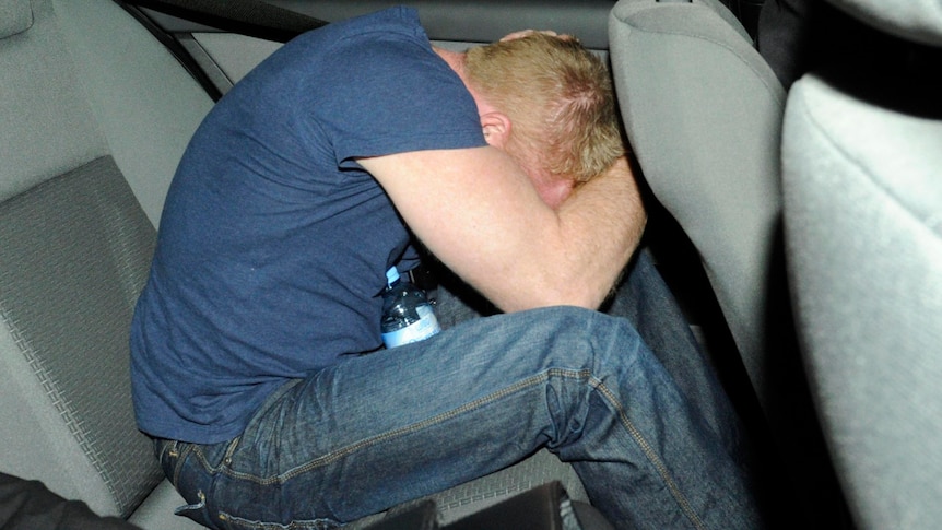 Adrian Ernest Bayley is driven away in a police vehicle from the St Kilda Road Police Complex.