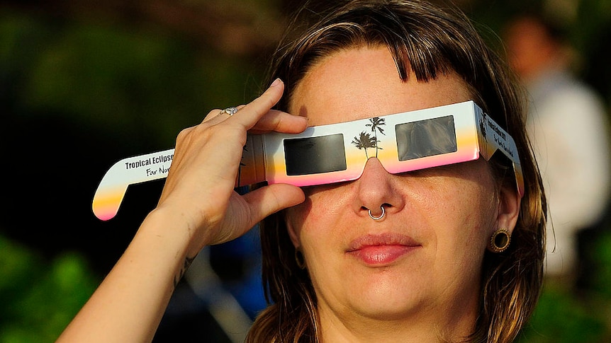 woman with eclipse glasses