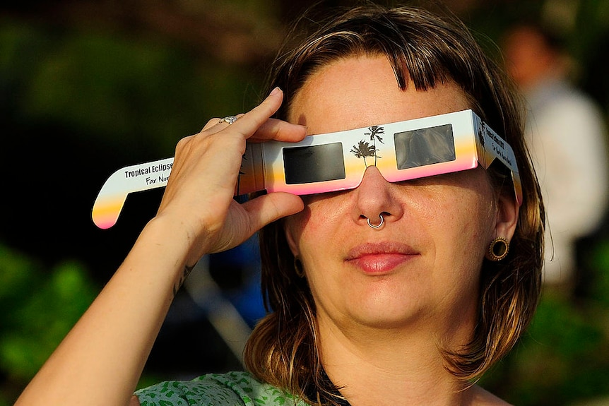 woman with eclipse glasses