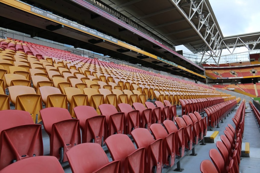 Rows of empty seats in a stadium.