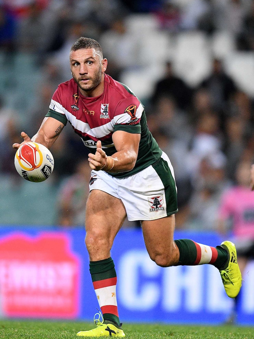 Robbie Farah of Lebanon passes the ball during the Pool A Rugby League World Cup match.