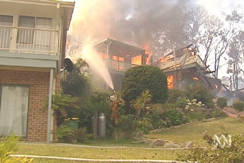 Bushfires have destroyed homes on the New South Wales central coast.