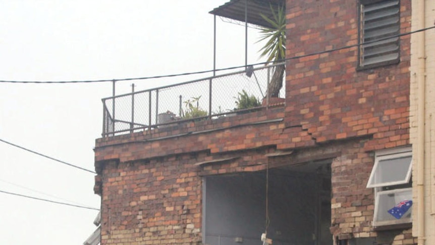 One wall of a building collapses in Toowoomba after flash flooding on January 10, 2011.