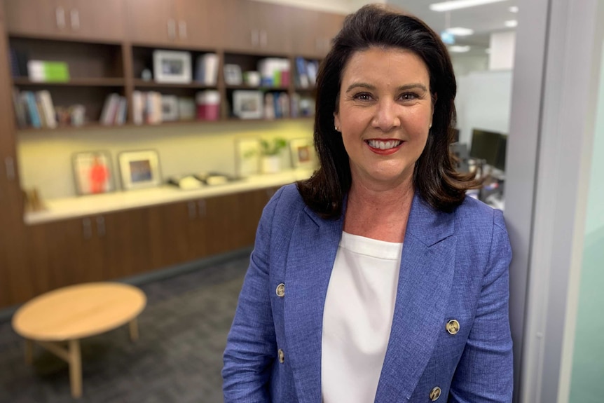 Senator Jane Hume standing smiling in her electorate office in Richmond.