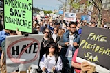 Protesters rally near the Intrepid Air and Sea Museum where President Trump is expected to visit.