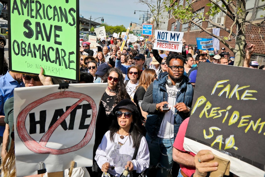 Protesters rally near the Intrepid Air and Sea Museum where President Trump is expected to visit.