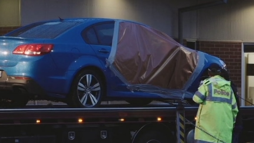 Police search a car