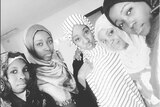 Five women wear hijabs