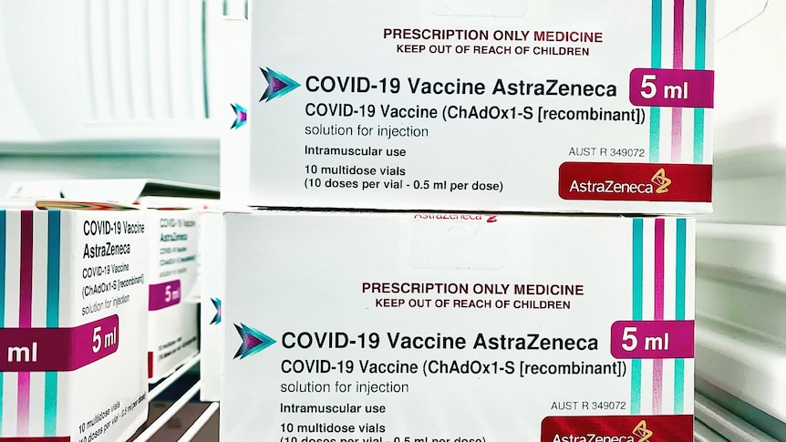 AstraZeneca vaccines boxes sit in a fridge.