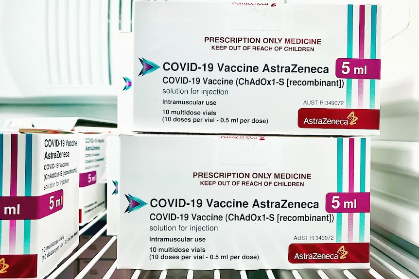 AstraZeneca vaccines boxes sit in a fridge.