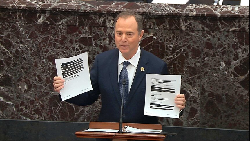 Adam Schiff, D-Calif., holds redacted documents as he speaks during the impeachment trial against President Donald Trump in