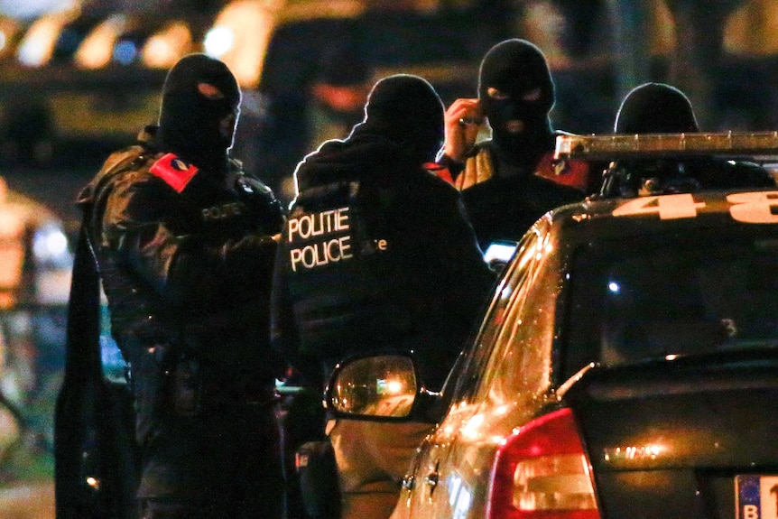 Belgian special police forces take part in an operation in Molenbeek, Brussels