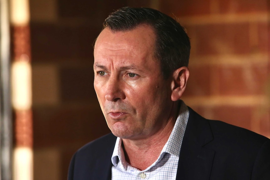 WA Premier Mark McGowan speaks during a press conference inside a building site in Piara Waters, Perth