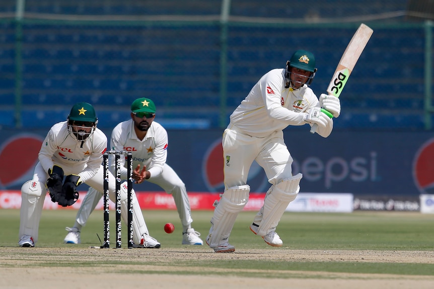 Fielders And Wicketkeepers Look On As Usman Khawaja Plays A Shot To The On Side