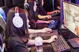 Jasmine Nguyen playing Counter-Strike with her eSports team