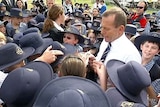 Tony Abbott campaigns at a school in Brisbane