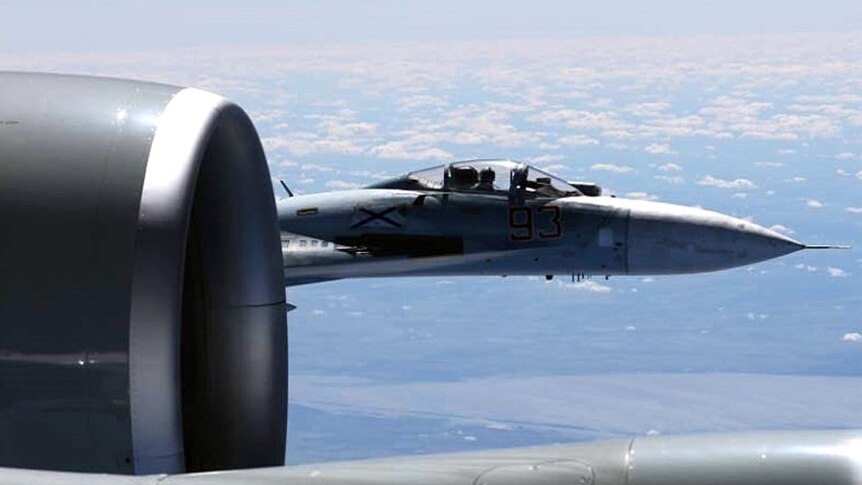 A US-RCE-135U Spy plane is intercepted by a Russian SU-27.