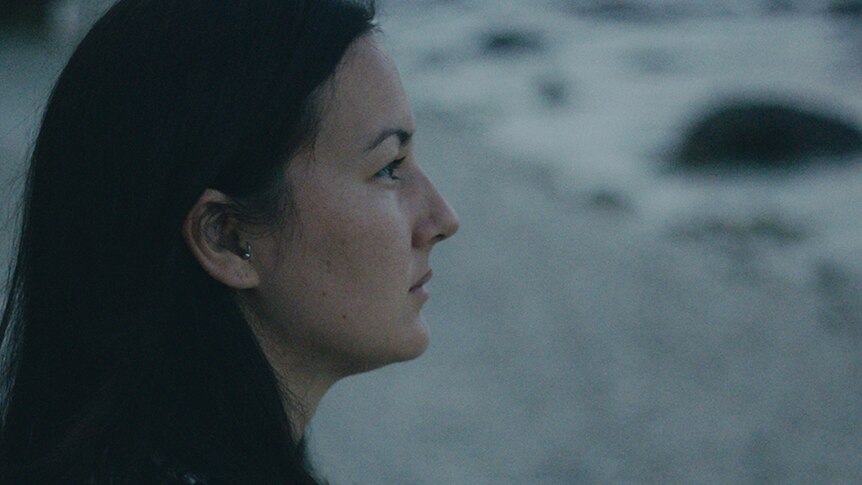 Colour still of social worker Poh Lin Lee in 2018 film Island of the Hungry Ghosts.