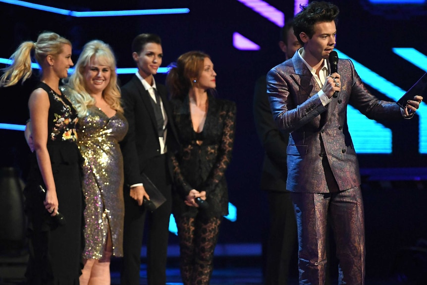 Four women and Harry.