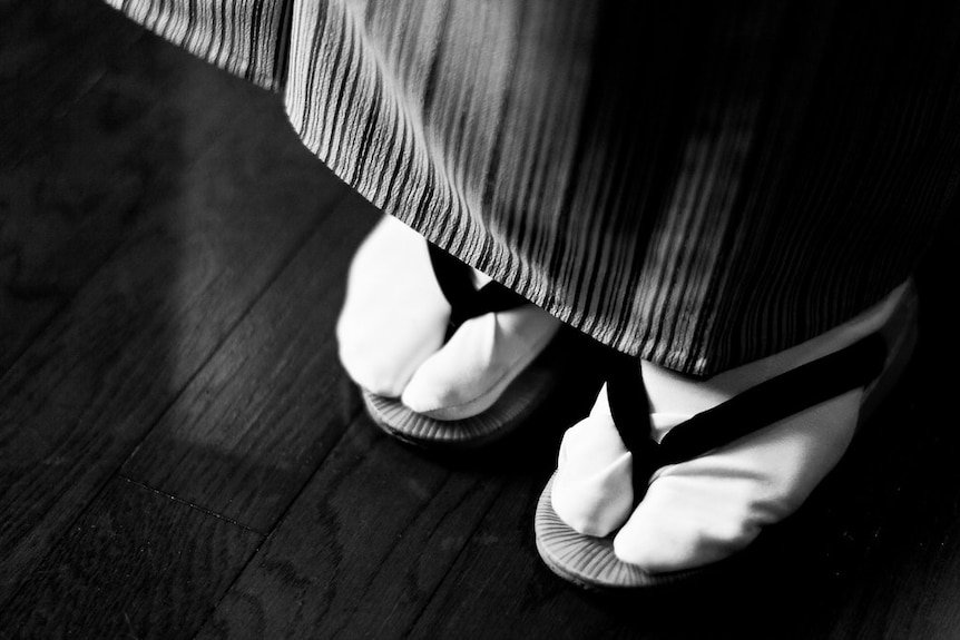 black and white image of tabi socks and footwear