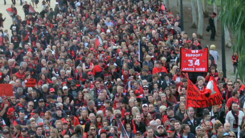 Essendon fans march to the MCG