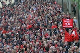 Essendon fans march to the MCG