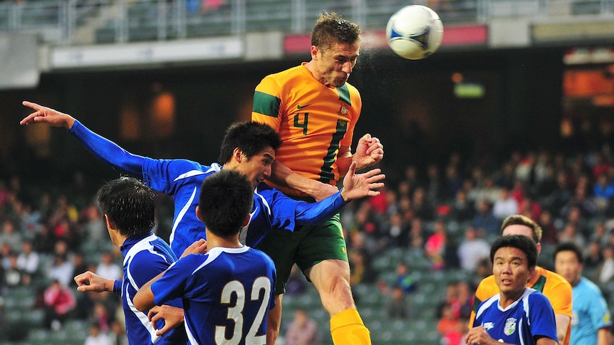 Aerial dominance ... Australia's Dino Djulbic contests the ball in the air against Taiwan.