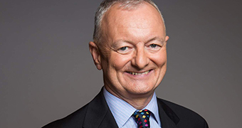 A head and shoulders shot of Antony Green smiling for a photo.