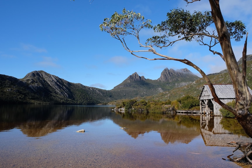 A mountain range sits at the back of a lake