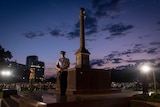 Sun rising over the Darwin cenotaph at the Anzac Day dawn service.