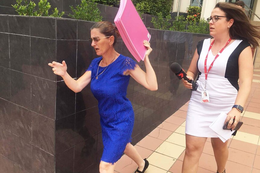 Margaret West leaves Rockhampton Magistrates Court with local media following her on January 15, 2018.