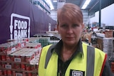 Headshot of a woman in the Foodbank distribution centre.