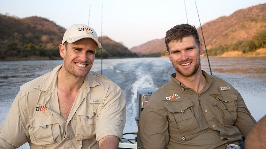 Brothers James and Nicholas Blevin on a speed boat on the Zambezi.