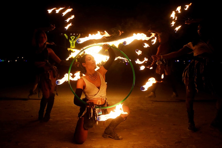 Burning Man participants from the Revolutionary Motion fire conclave.